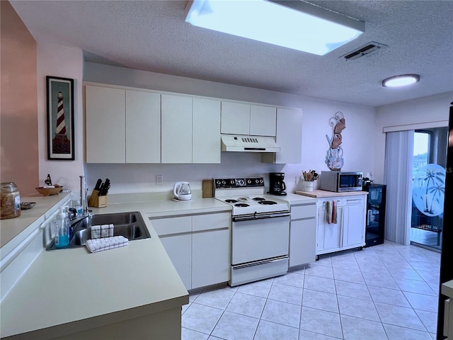 kitchen with sink, light tile patterned floors, a textured ceiling, white electric range oven, and white cabinetry