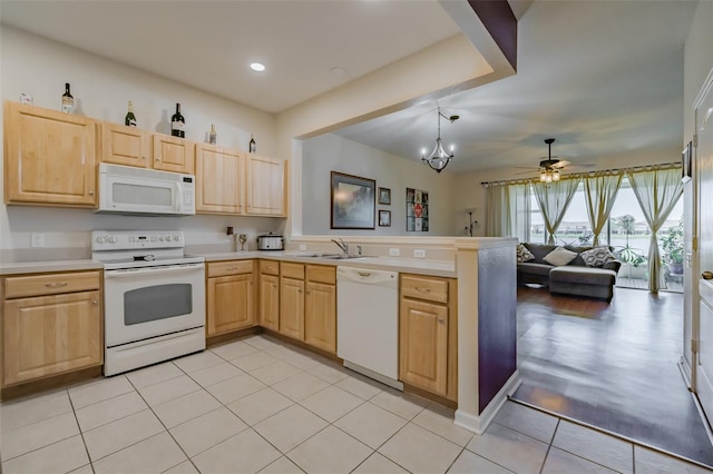 kitchen featuring light wood-type flooring, light brown cabinets, white appliances, and kitchen peninsula