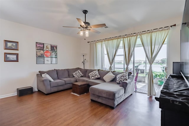 living room with hardwood / wood-style flooring and ceiling fan