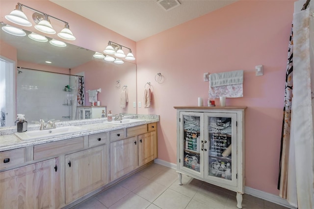 bathroom with tile patterned flooring and vanity