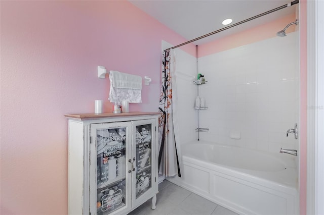 bathroom with tile patterned flooring and shower / bath combo