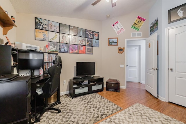 office area with wood-type flooring, vaulted ceiling, and ceiling fan