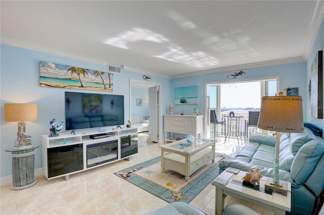 tiled living room with a textured ceiling and ornamental molding