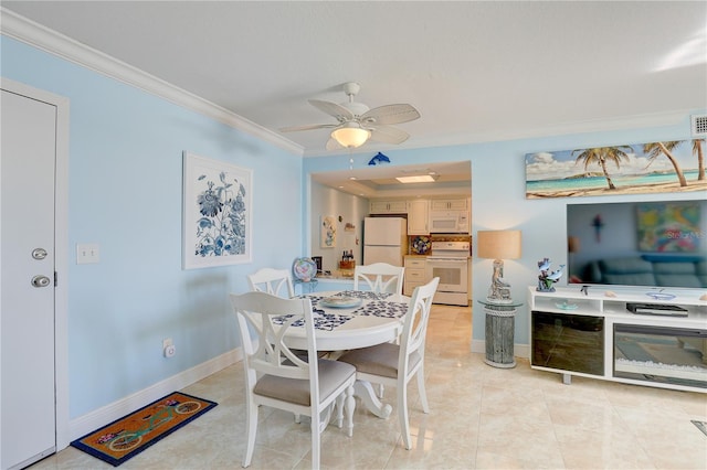 tiled dining room featuring ceiling fan and ornamental molding