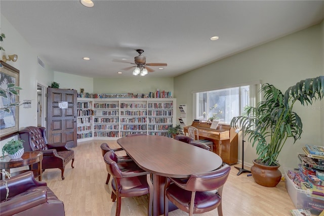 dining room featuring light wood-type flooring and ceiling fan