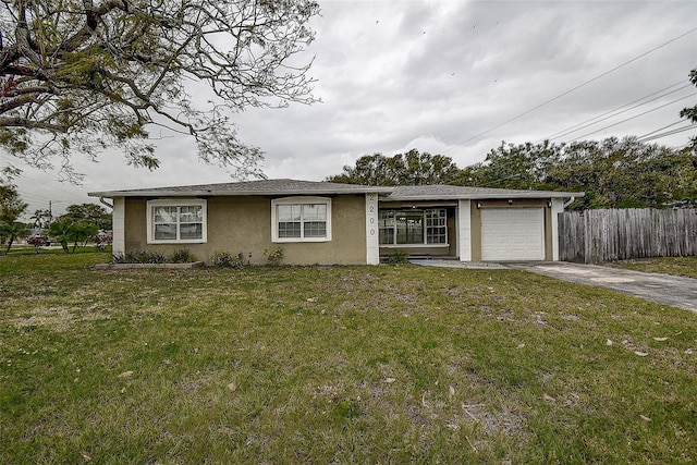 view of front of house featuring a front yard and a garage