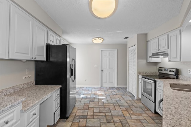 kitchen featuring appliances with stainless steel finishes, light stone counters, a textured ceiling, sink, and white cabinetry