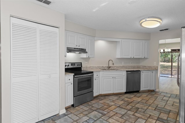 kitchen with white cabinetry, sink, stainless steel appliances, and an inviting chandelier