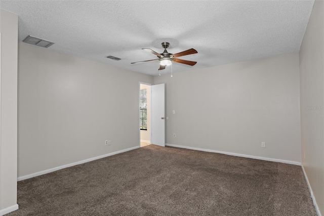 unfurnished room with ceiling fan, carpet floors, and a textured ceiling