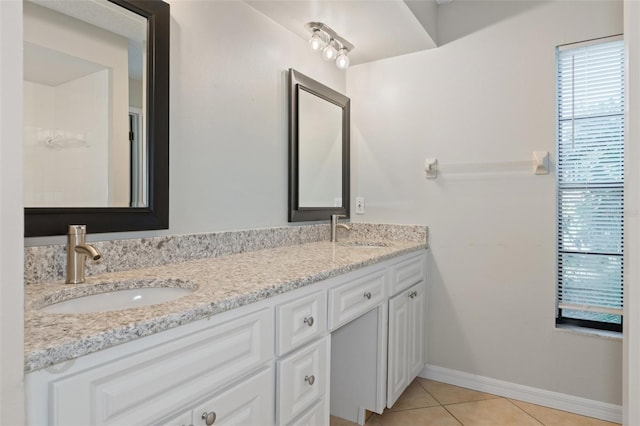 bathroom with tile patterned flooring and vanity