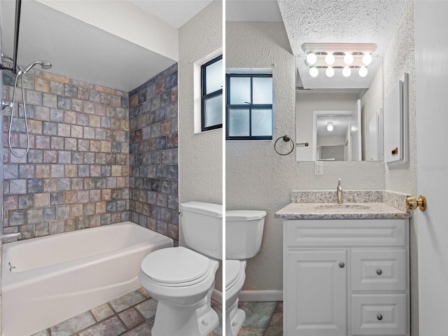 full bathroom featuring vanity, toilet, and tiled shower / bath