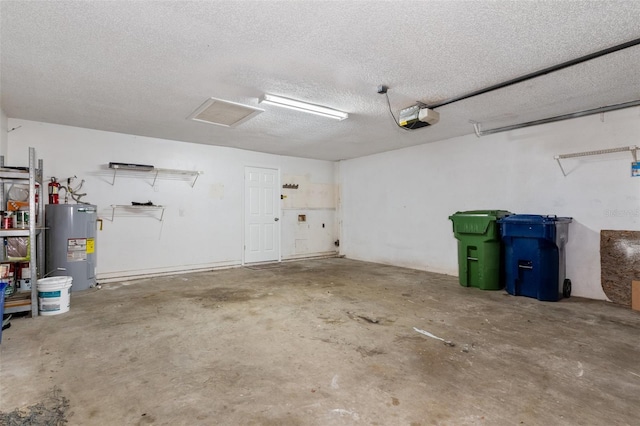 garage featuring a garage door opener and water heater