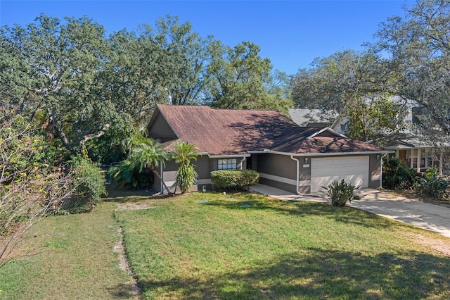 ranch-style home featuring a front lawn and a garage