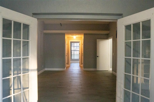 empty room featuring dark wood-type flooring