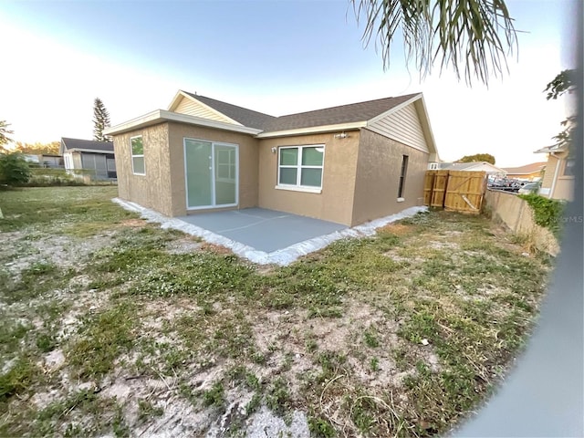 rear view of property with a patio