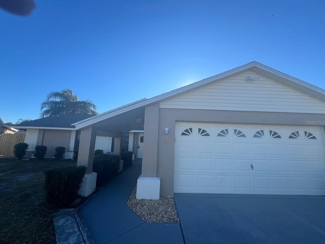 view of side of home featuring a garage