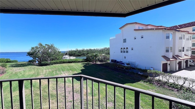 balcony featuring a water view