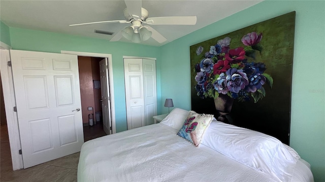 tiled bedroom with ceiling fan