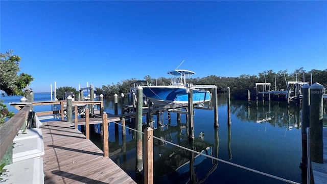 1515 Pinellas Bayway S Unit 35, Tierra Verde, FL 33715 - dock with boat lift and a water view