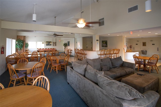 1515 Pinellas Bayway S Unit 35, Tierra Verde, FL 33715 - carpeted living room with ceiling fan and high vaulted ceiling