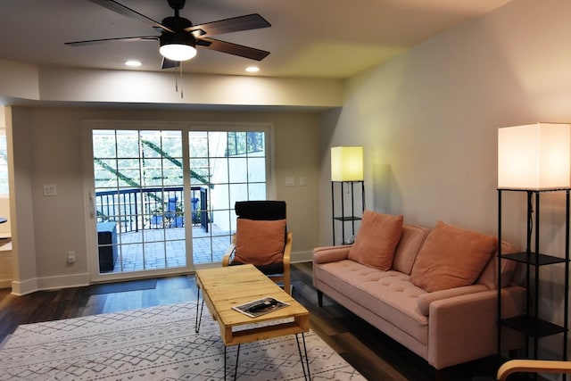 living room with ceiling fan and hardwood / wood-style floors