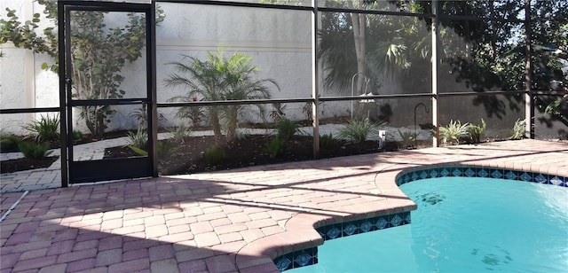 view of pool featuring a lanai and a patio