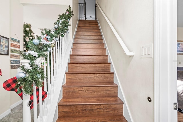 staircase featuring tile patterned floors