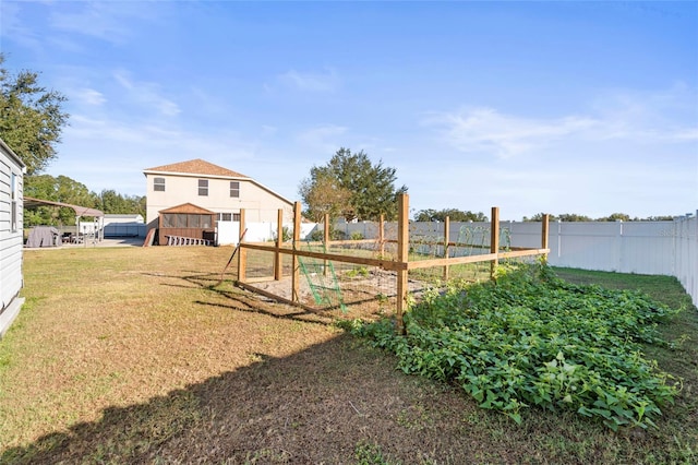 view of yard featuring a playground and fence