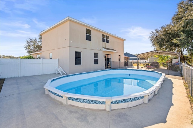 view of pool with a fenced in pool and fence