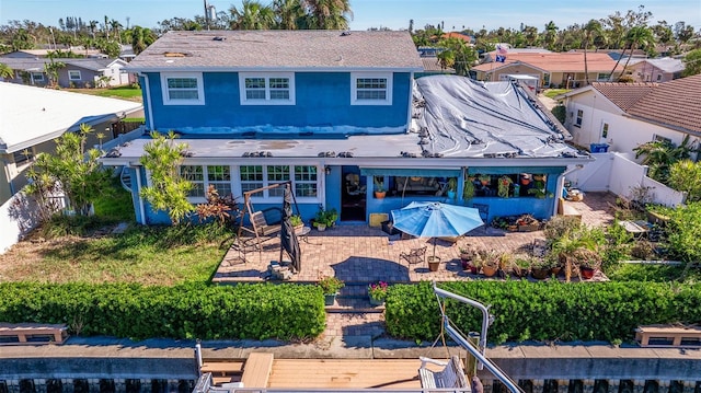 rear view of property featuring a patio area