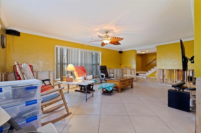 living room with crown molding, tile patterned flooring, and ceiling fan