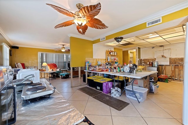 misc room featuring light tile patterned floors and ornamental molding