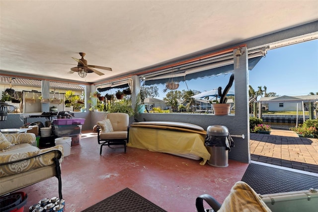 interior space featuring ceiling fan and a healthy amount of sunlight