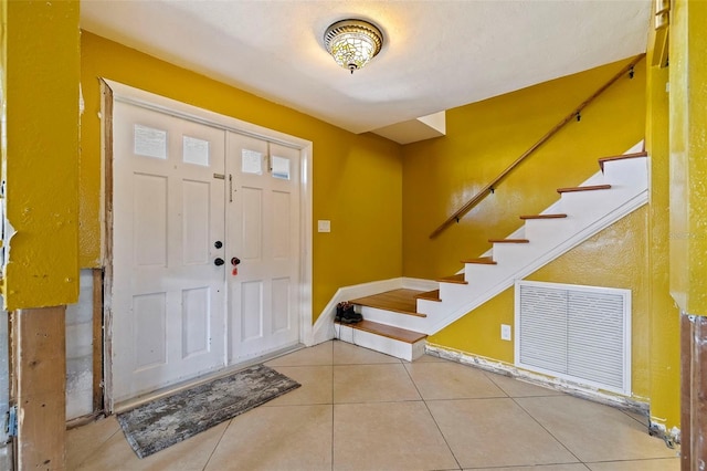 entrance foyer featuring tile patterned flooring