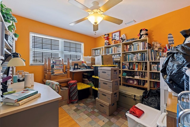 office area with ceiling fan and light hardwood / wood-style floors