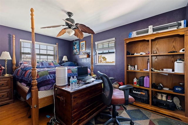 bedroom featuring hardwood / wood-style floors and ceiling fan