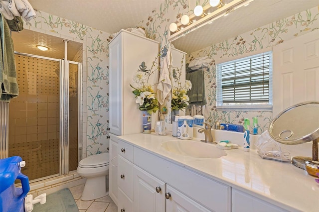 bathroom with walk in shower, tile patterned flooring, vanity, and toilet