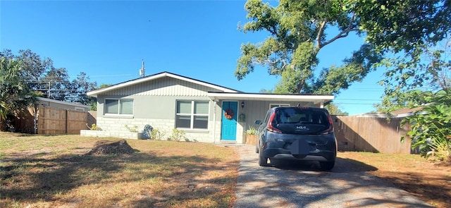 view of front of home with a carport