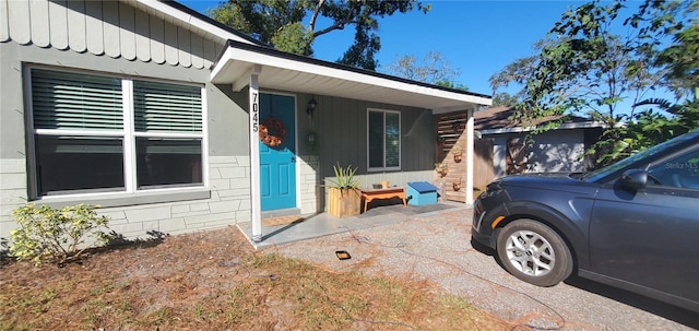 7045 Lenox Dr, New Port Richey, FL 34653 - view of side of home featuring concrete block siding