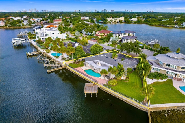 birds eye view of property with a water view