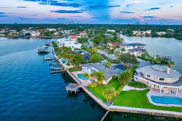 aerial view at dusk with a water view