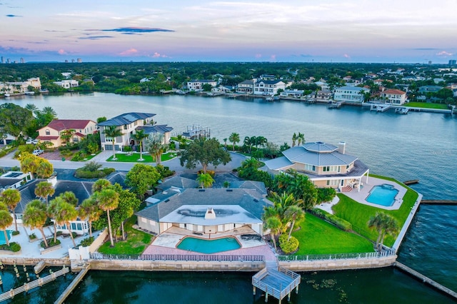 aerial view at dusk with a water view