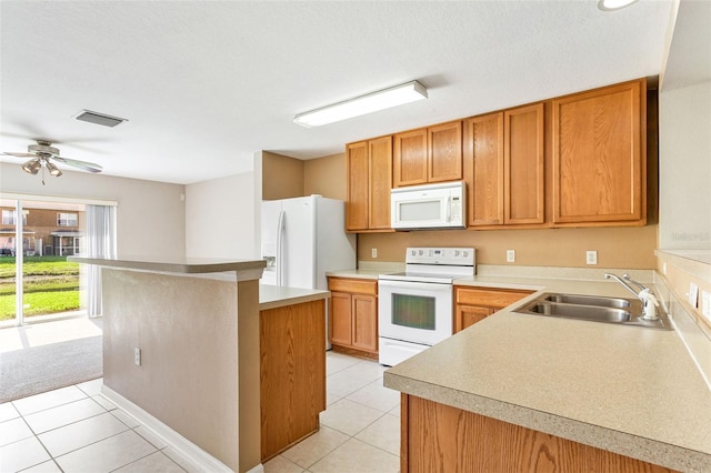 kitchen with ceiling fan, sink, light tile patterned floors, and white appliances