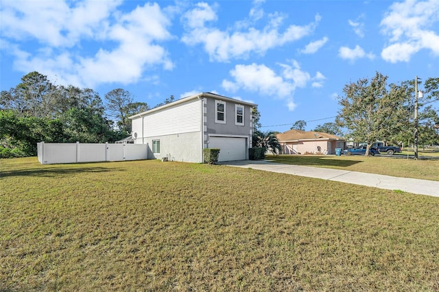 view of home's exterior featuring a yard and a garage