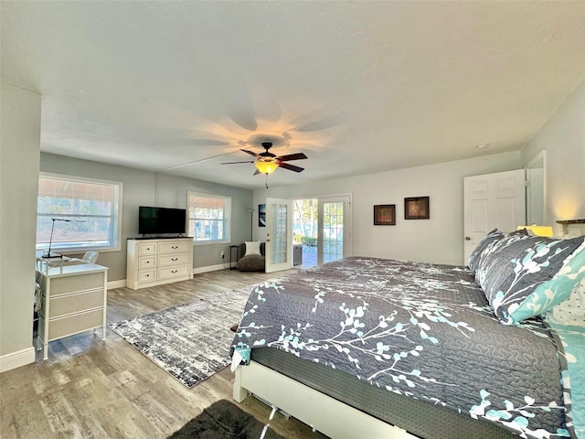 bedroom with ceiling fan and light hardwood / wood-style floors