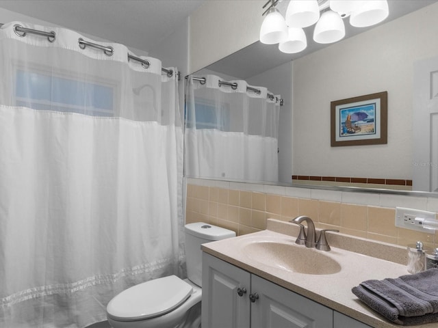 bathroom with vanity, curtained shower, toilet, and backsplash