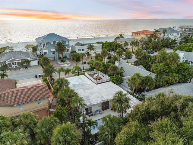 aerial view at dusk with a water view