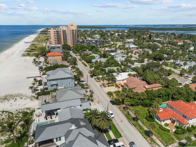 drone / aerial view with a water view and a view of the beach