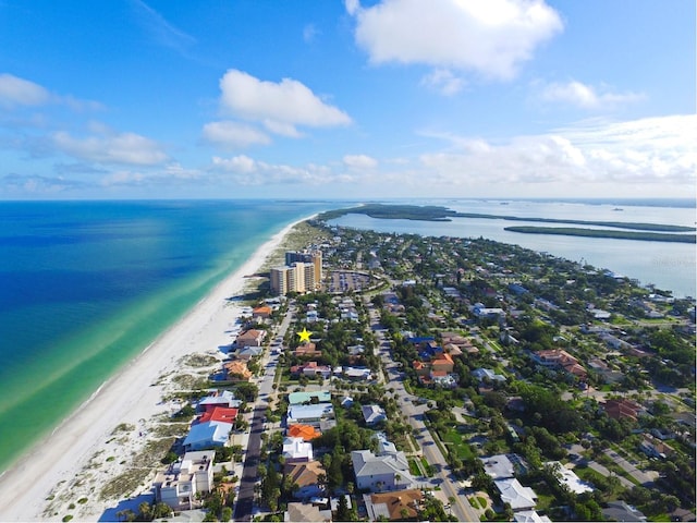 birds eye view of property with a beach view and a water view