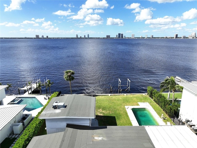 birds eye view of property featuring a water view